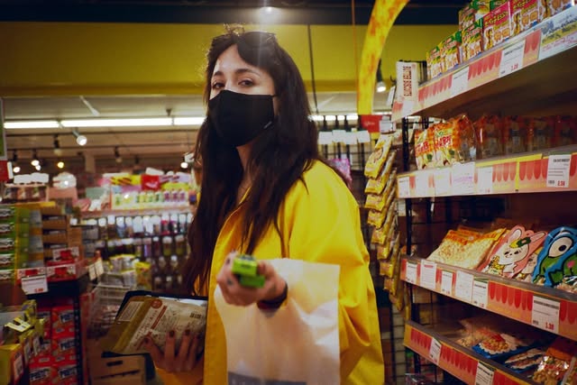 Candid portrait in a market aisle
