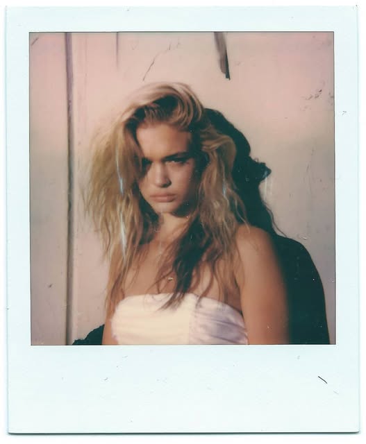 Polaroid-style fashion portrait in pink tones