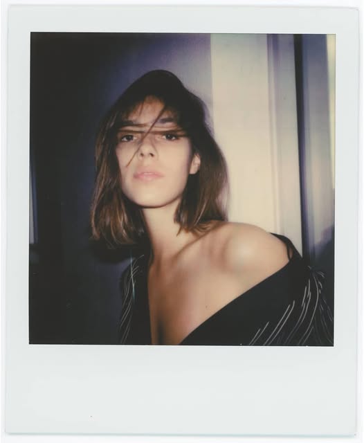 Polaroid-style portrait by a window